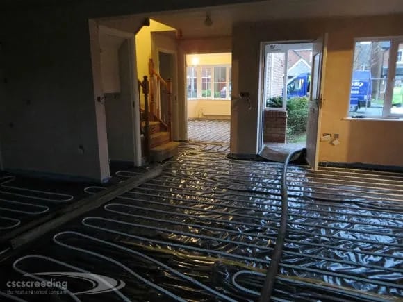 Whole house being set up for underfloor heating inscreed on screed
